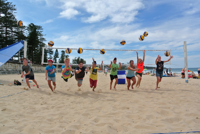 Kids & Teenagers Playing Beach Volleyball